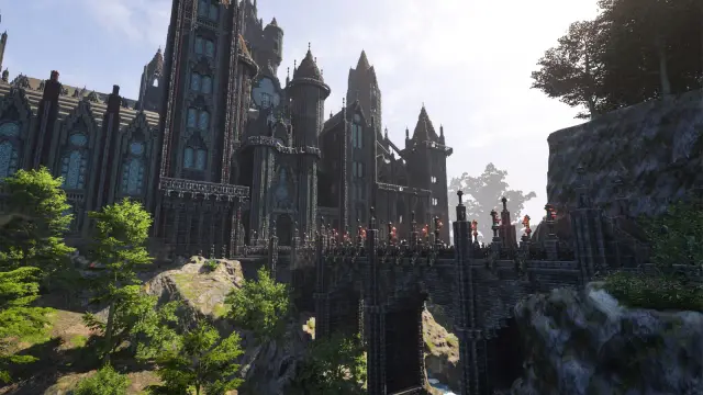 A large player-built stone castle between a forest and high cliffs